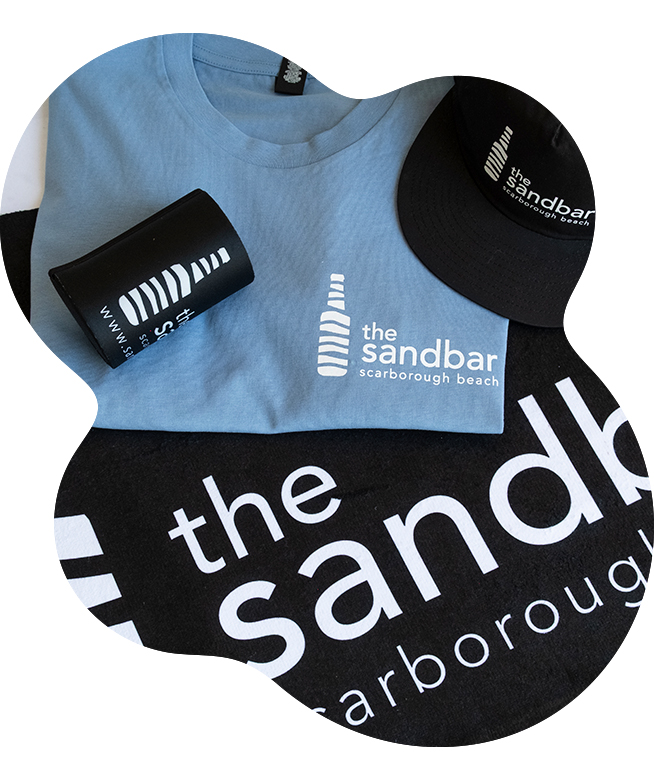 The Sandbar Scarborough Beach branded merch set including a screenprinted light blue t-shirt, DTF black cap, sublimated stubby holder and beah towel all printed with the matching Sandbar logos