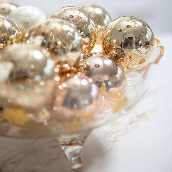 ornaments in gold glass bowl