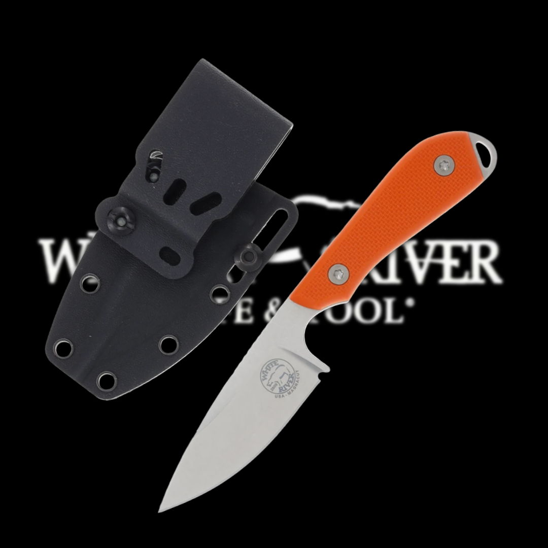 Knife with orange handle and black sheath on a dark background.