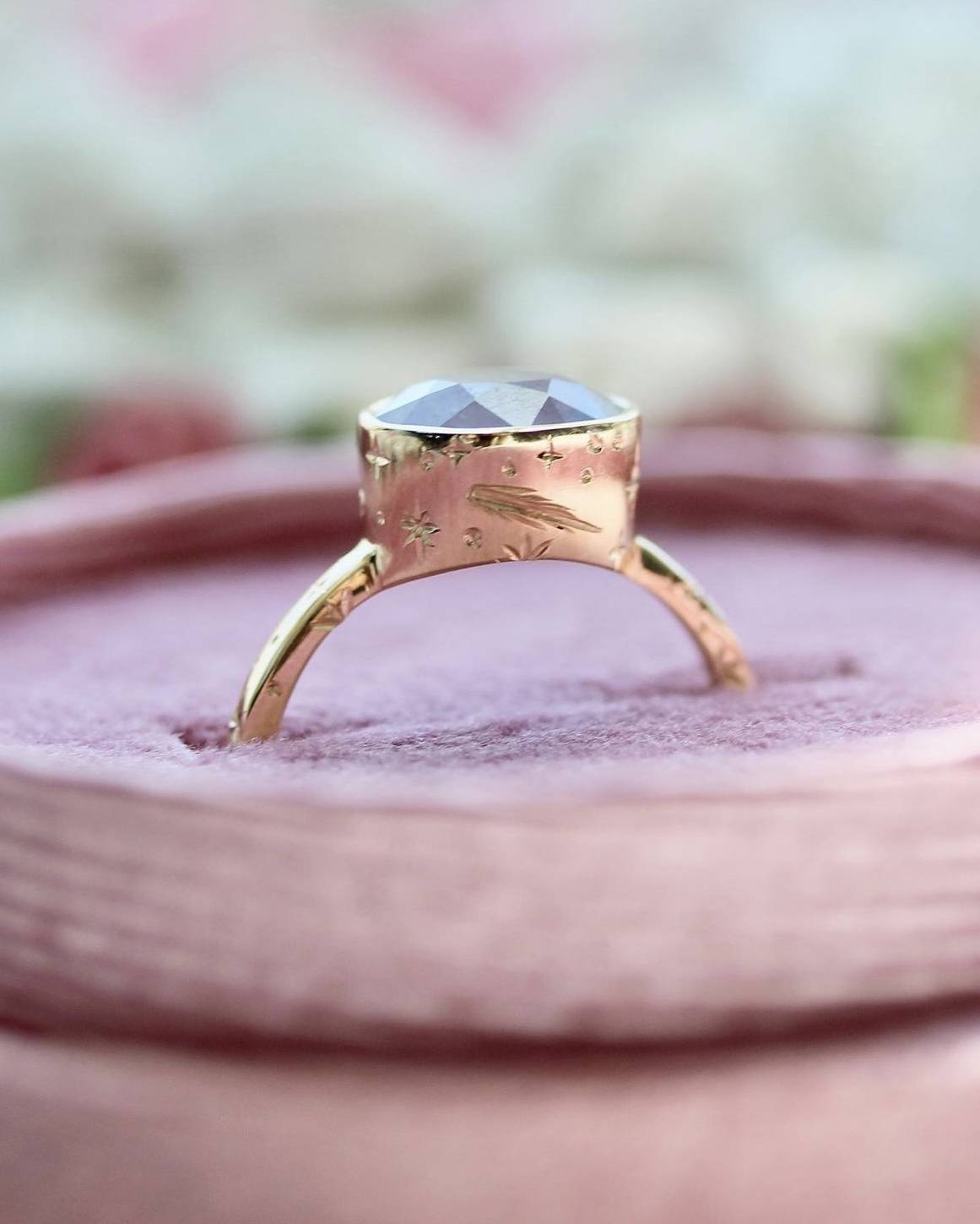 hand-engraved cosmic ring in a pastry plug custom cake ring box for gem breakfast