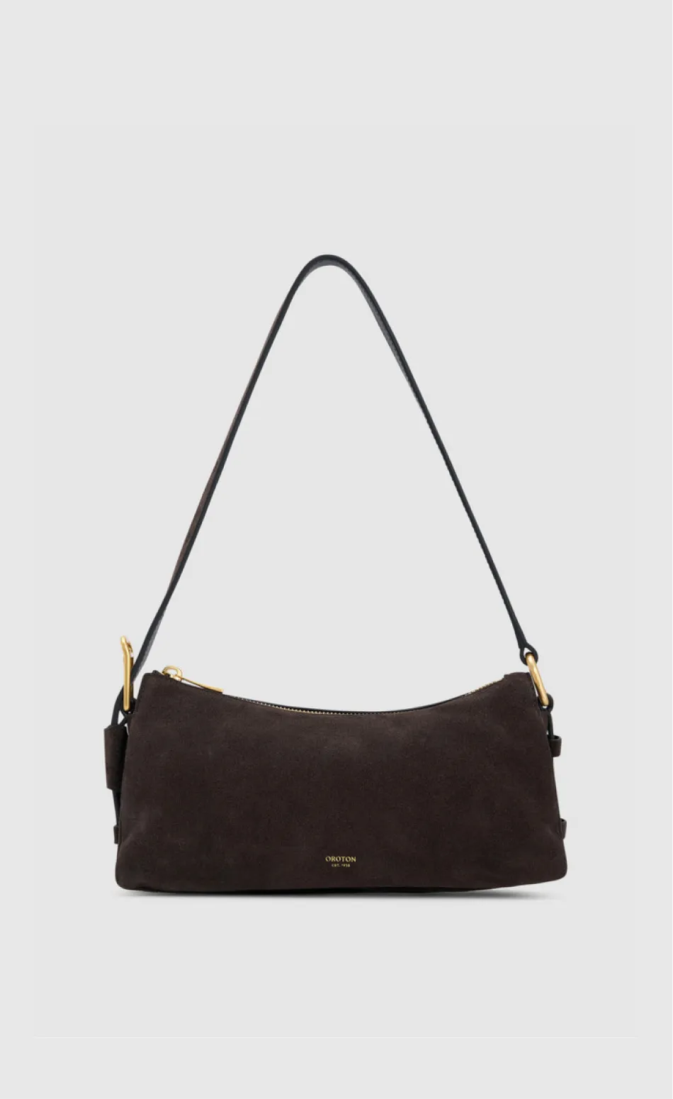 Brown suede handbag with a black strap.