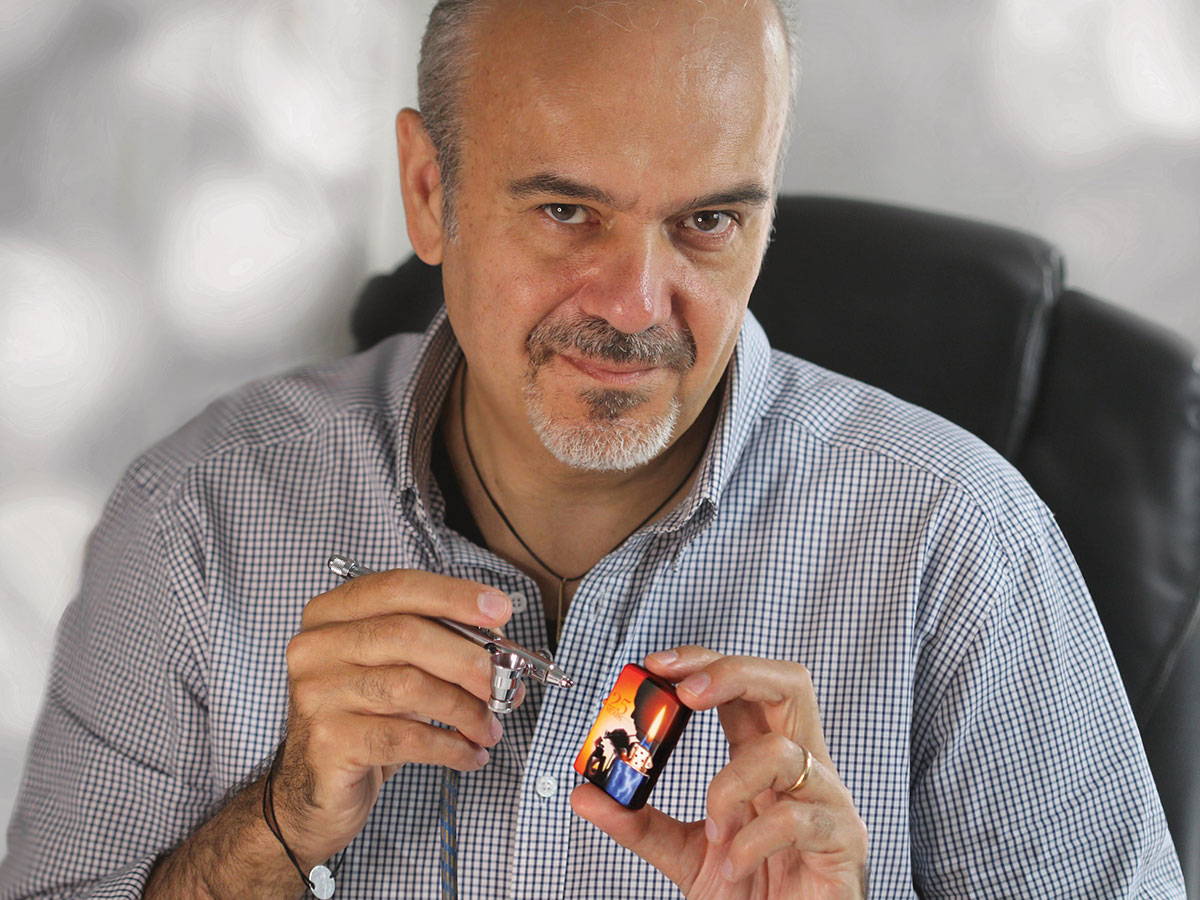Claudio Mazzi with airbrush and Zippo lighter.