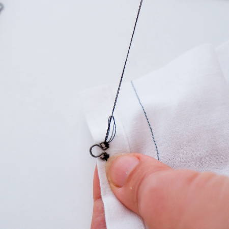  Attaching the eye with an end knot stitch