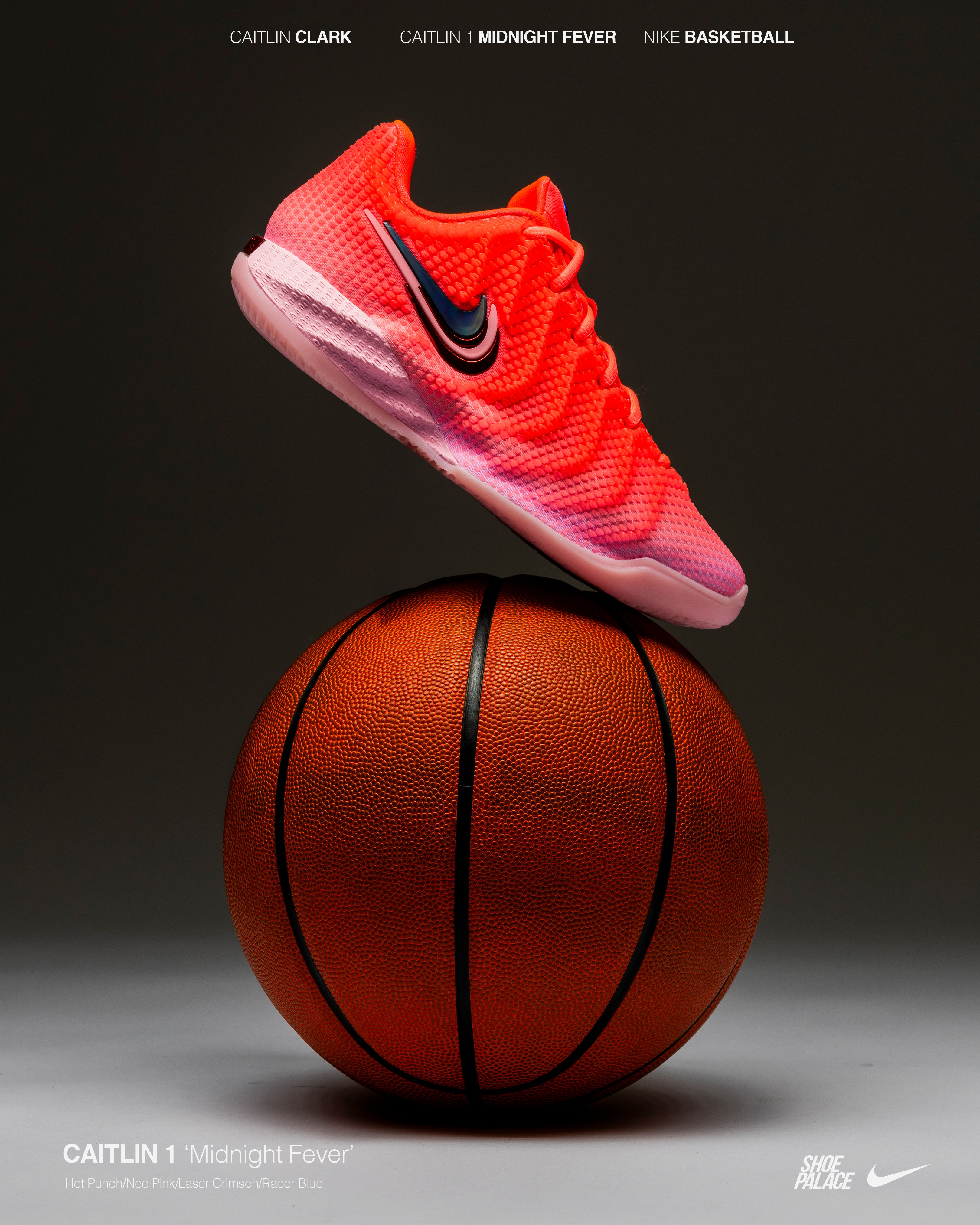 A pink Nike basketball shoe balanced on a basketball.