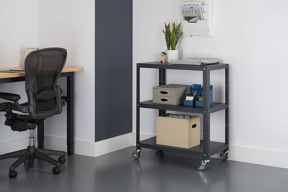Metal utility cart in office with items on shelves