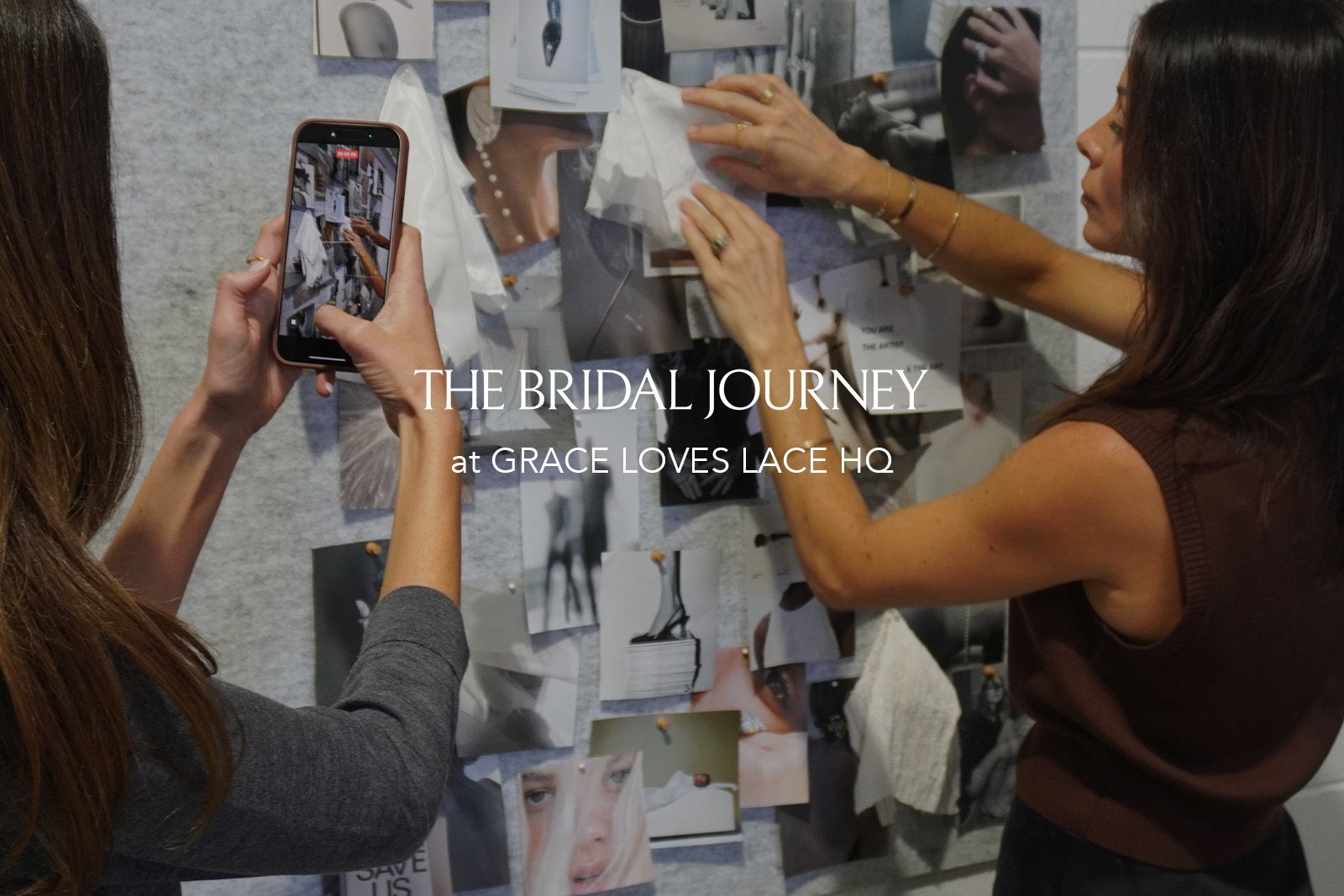 Two women interacting with a collage of bridal images.