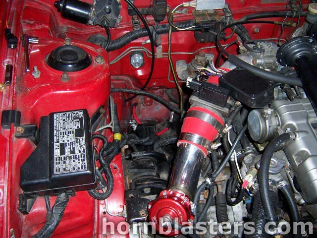Engine bay wide view 1992 Eagle Talon showing Shocker XL onboard air routing and bay hardware photo 5
