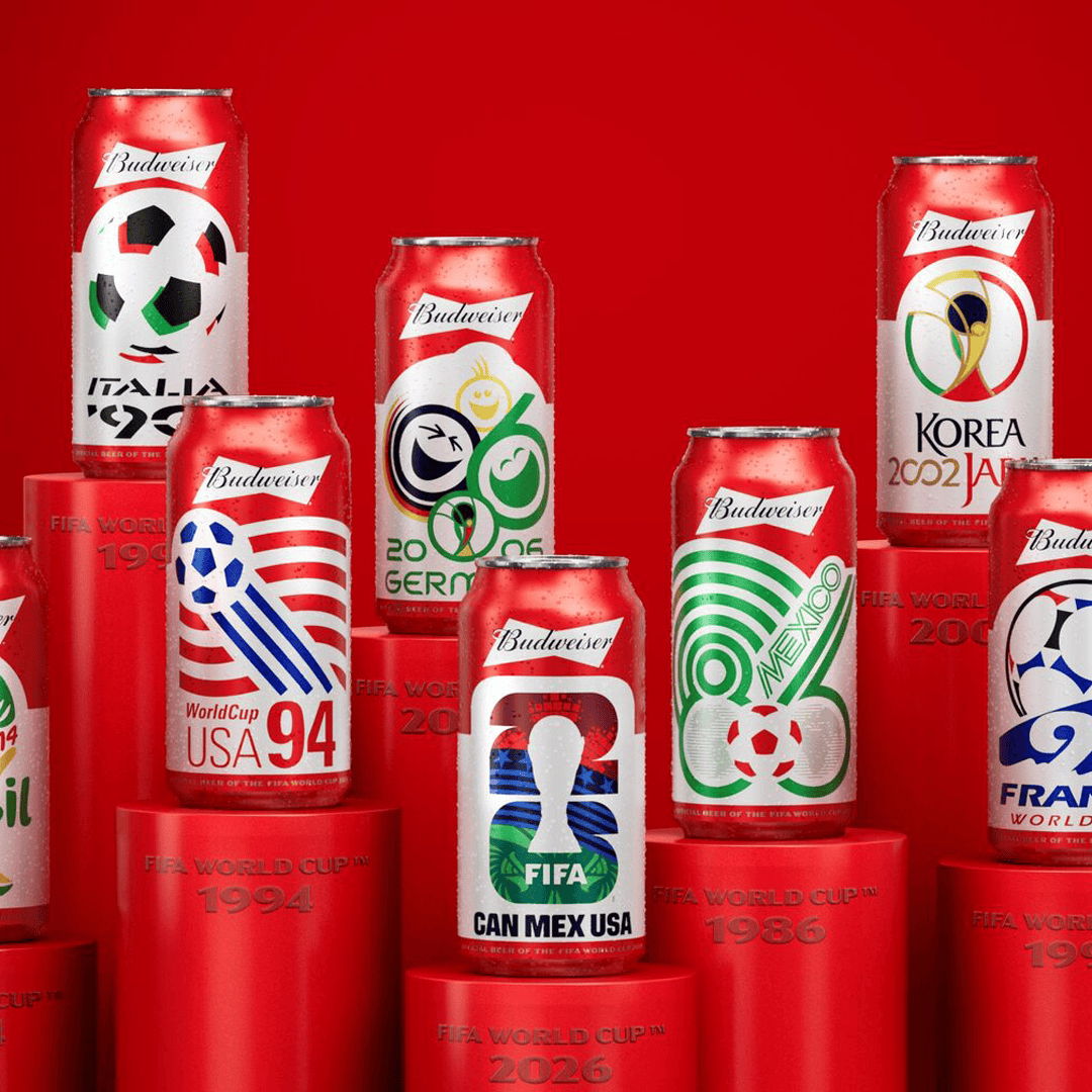 Cans of Budweiser featuring soccer-themed designs on a red background.