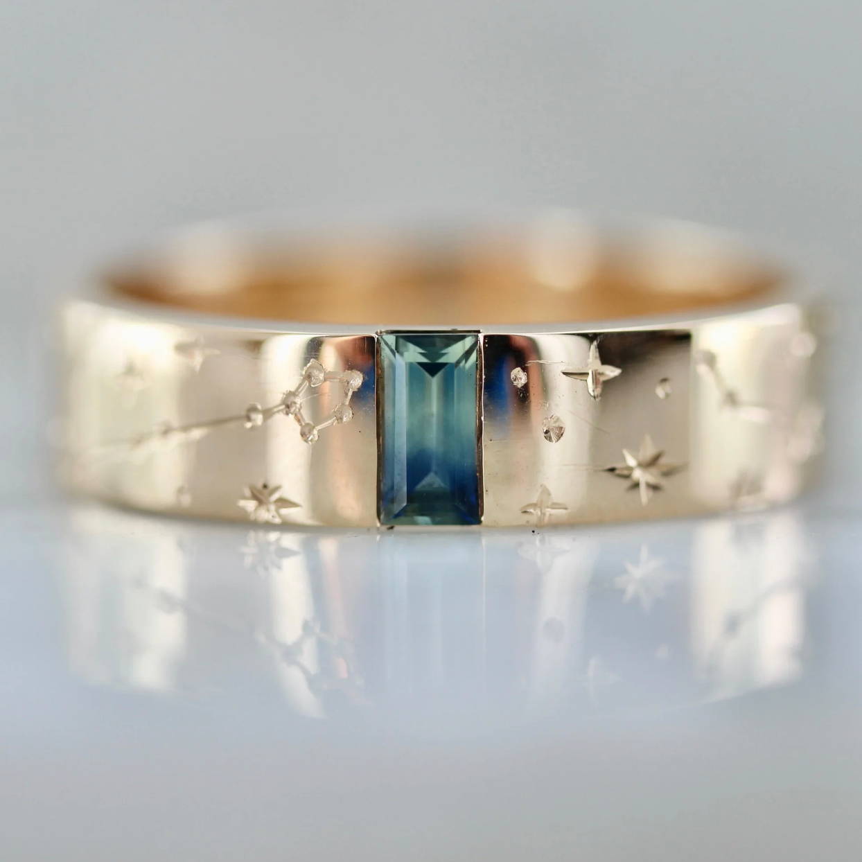 green sapphire band with star and constellation engraving
