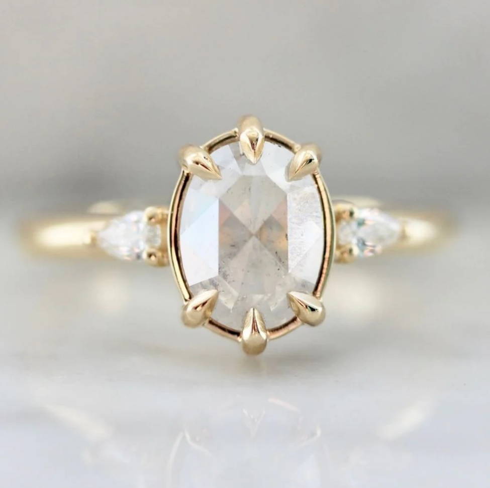 icy opalescent rose cut diamond oval diamond ring