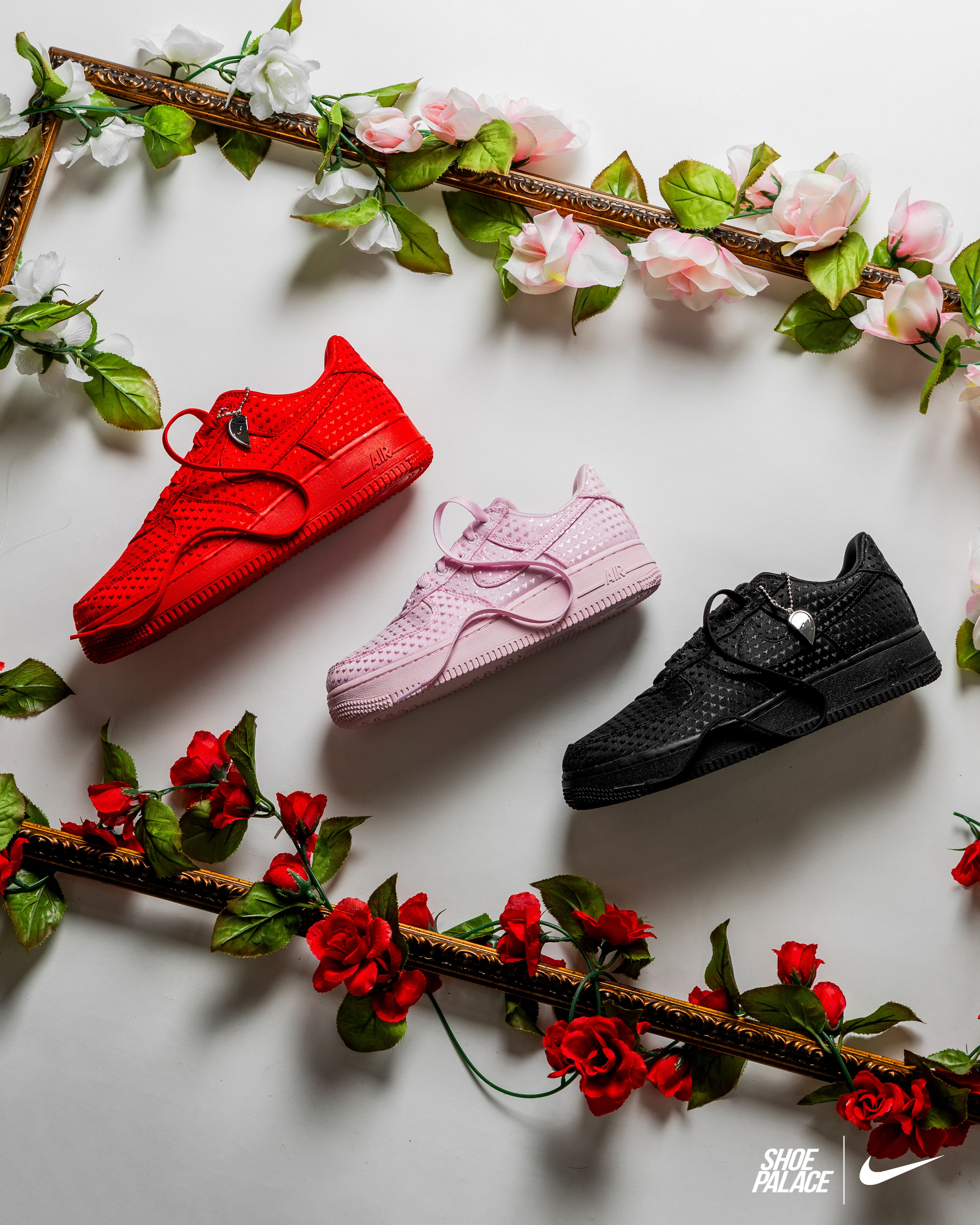 Three pairs of stylish sneakers surrounded by flowers.