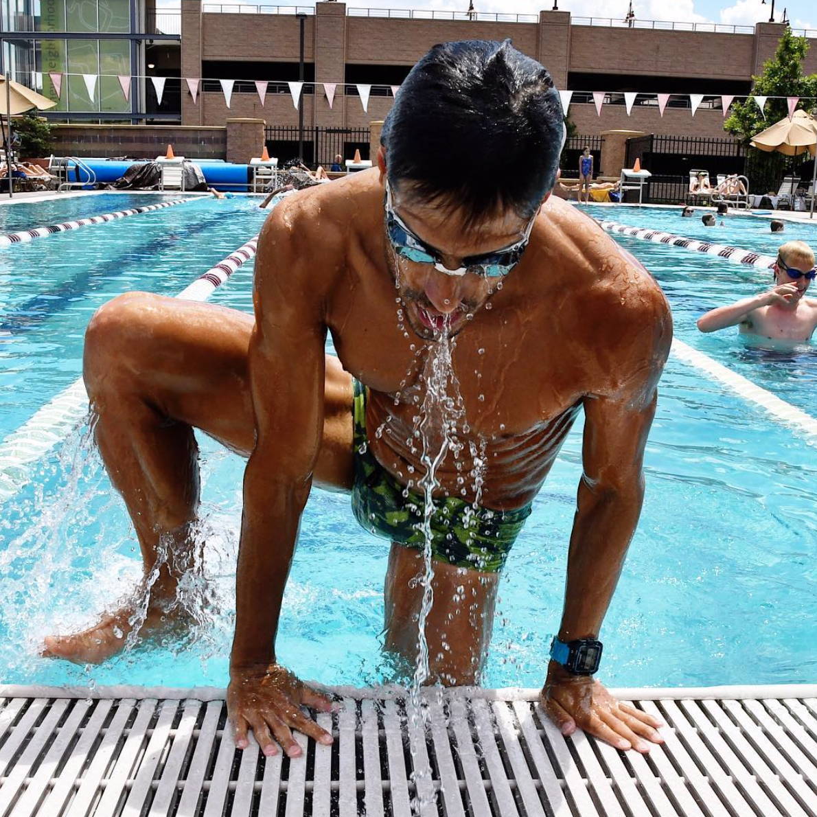 Eduardo climbing out of swimming pool