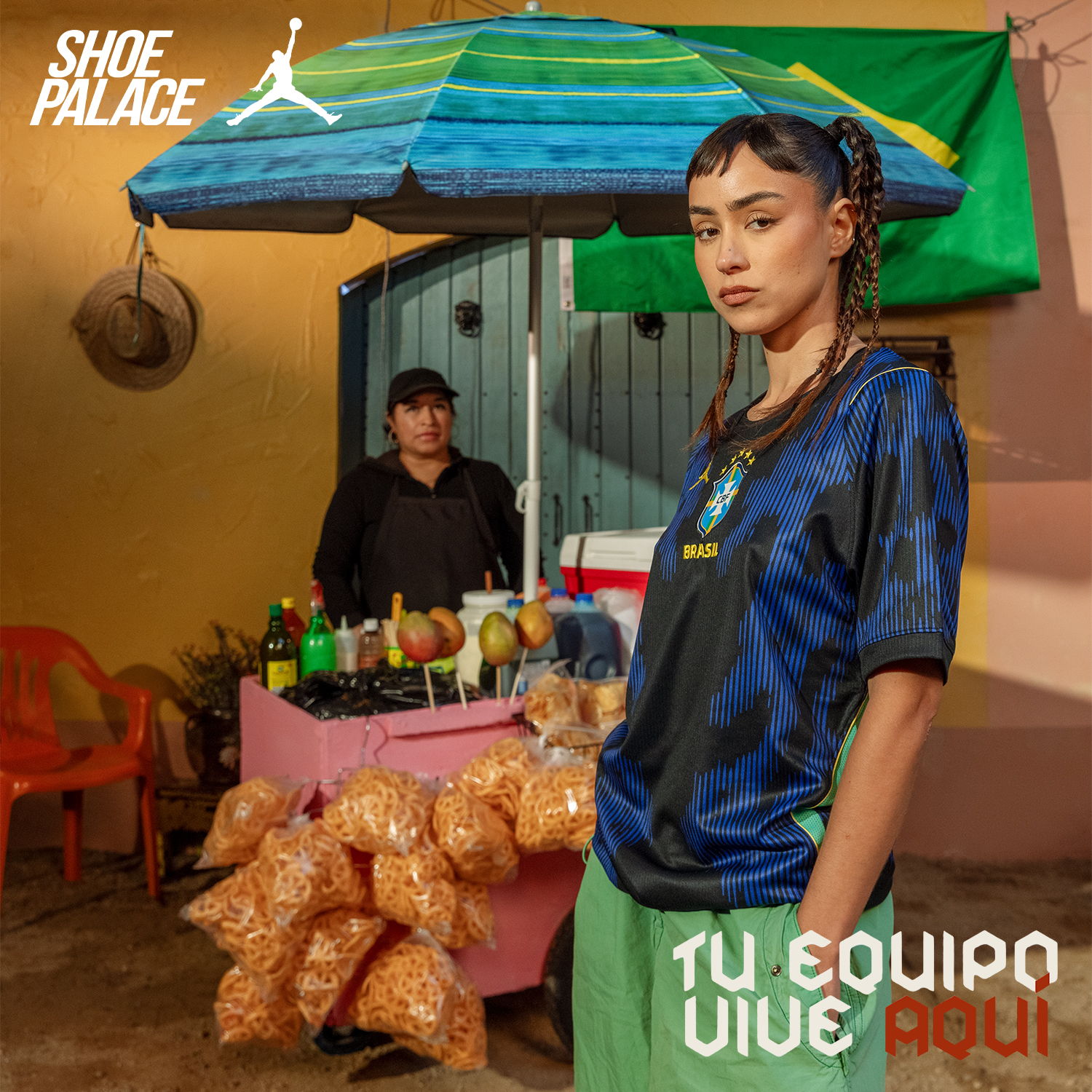 Young woman in sportswear standing by a food stall.