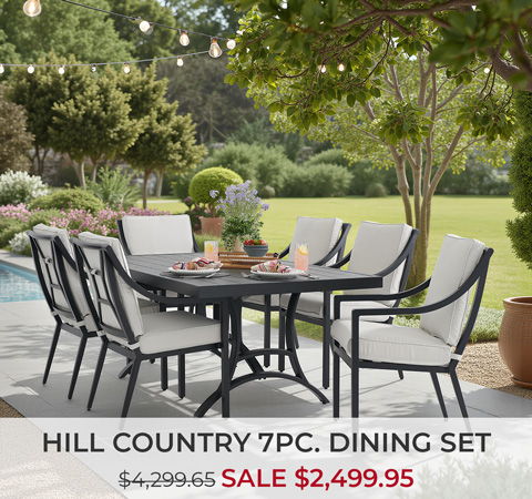Outdoor dining set with seven pieces, displayed in a garden setting.