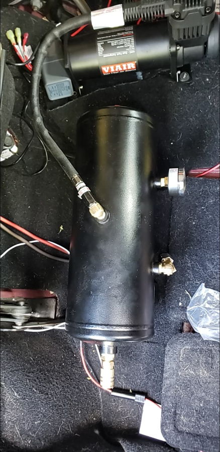 Viair air compressor and vertical air tank Outlaw Train Horn Kit onboard air system installed in cargo area Alvin's 2013 Jeep Rubicon gallery photo 3