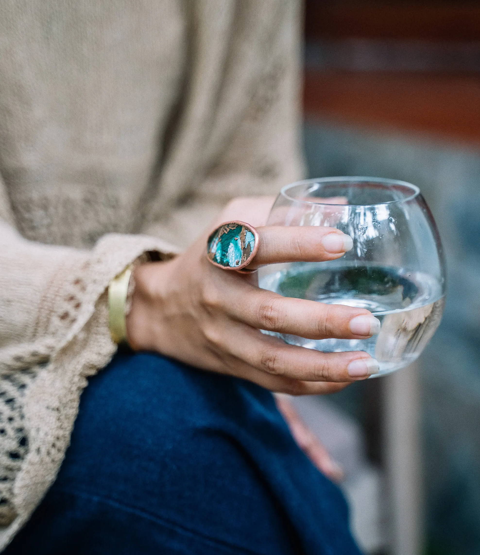 Woman holding glass of water