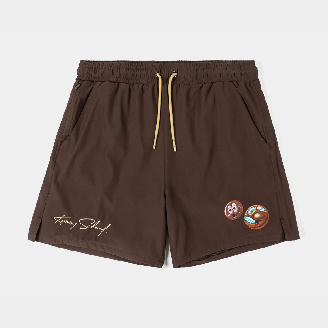 Brown shorts with drawstring and decorative patches.