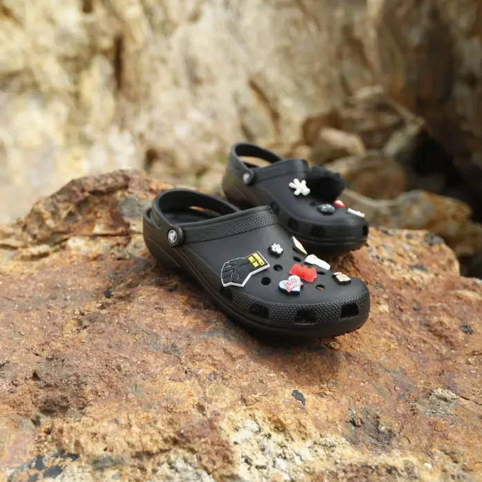 black crocs on beach