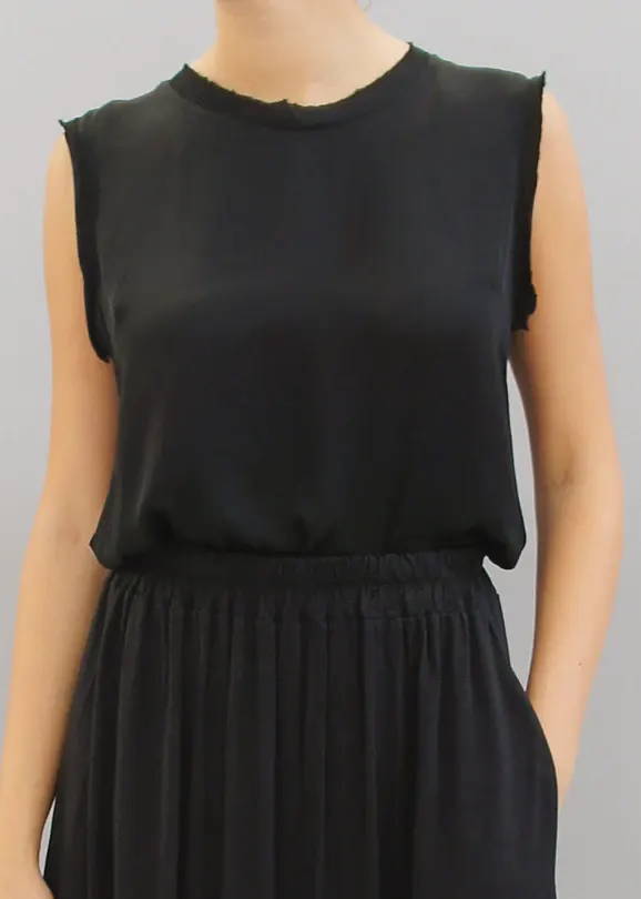 A model wearing a black sleeveless top