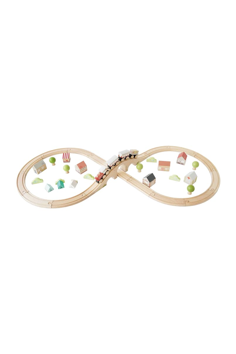 Wooden train track in an infinity shape with small houses and trees.