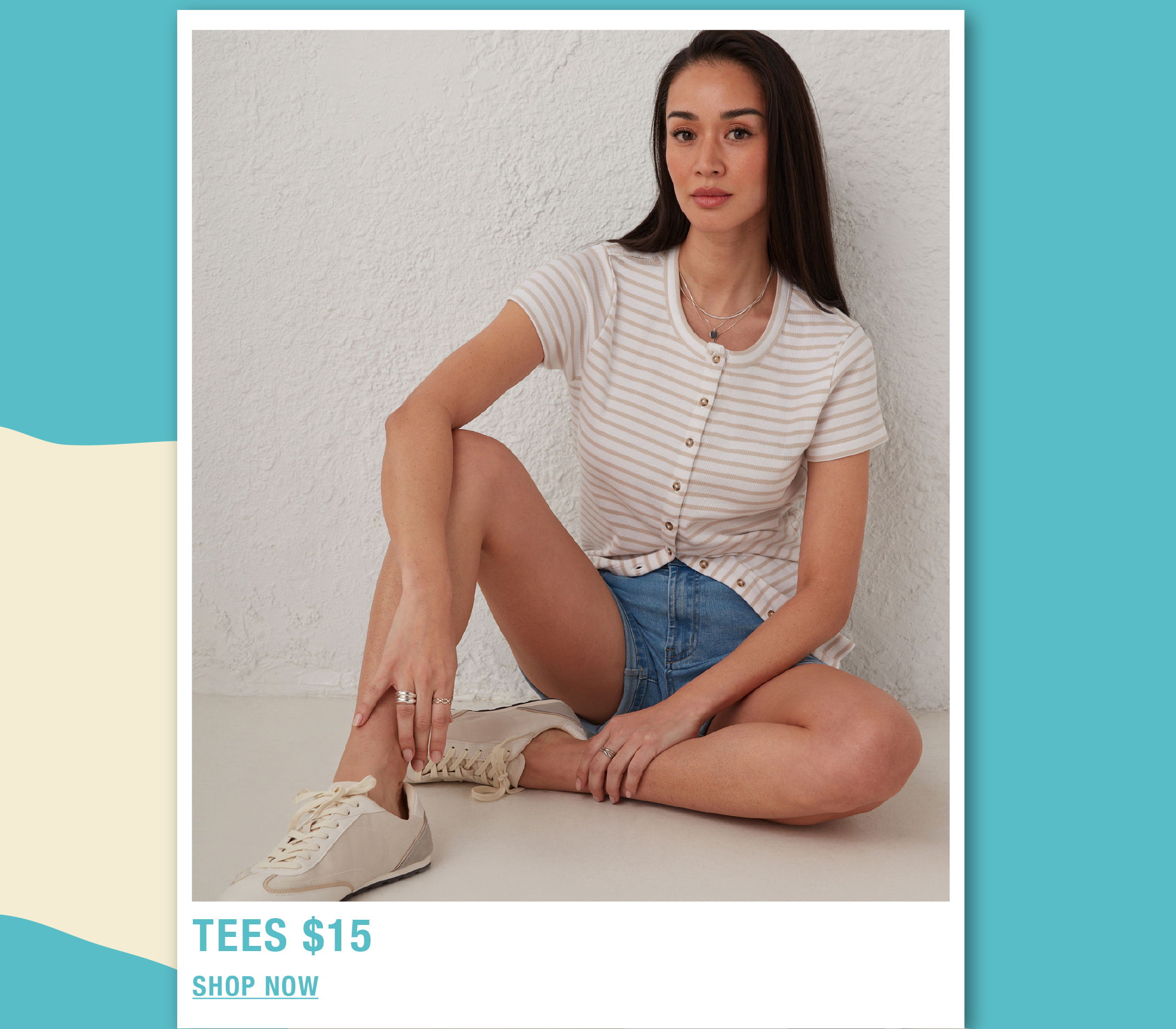 Model sitting in casual outfit, promoting $15 tees.
