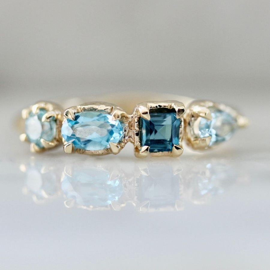 Blue zircon and blue topaz ring