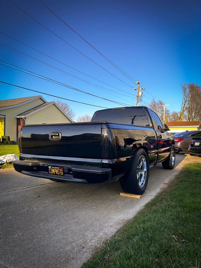 Side profile of 1999 GMC Sierra with Conductor's Special 228H train horn kit install HornBlasters gallery photo 2
