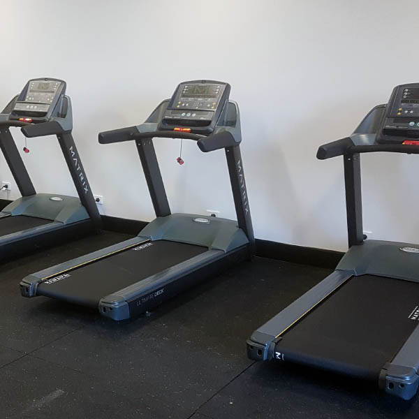 Fire Station Gym Fit Out equipped with high-end Matrix treadmills, providing advanced cardio training options.