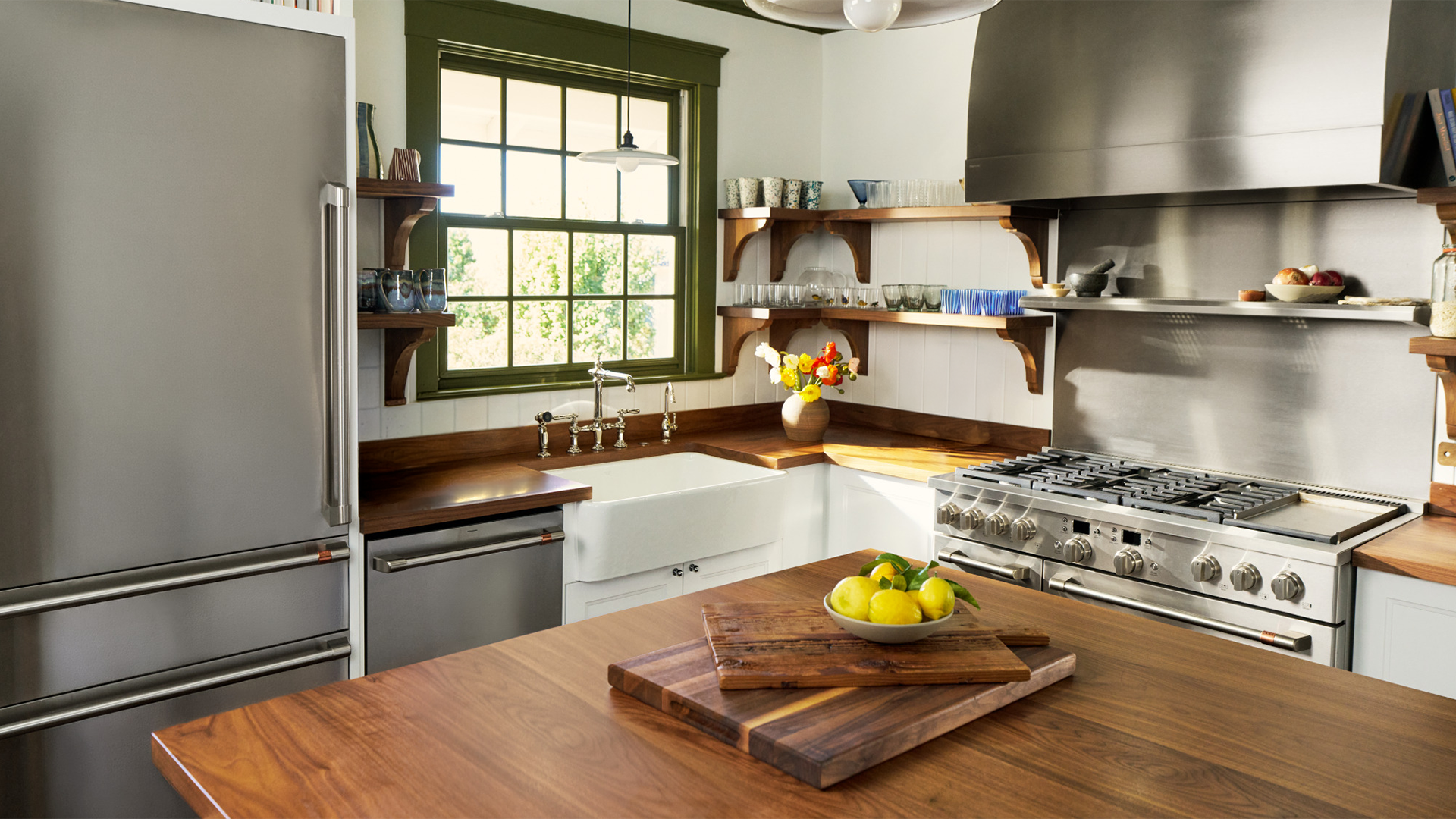Modern kitchen with stainless steel appliances and wooden countertops.