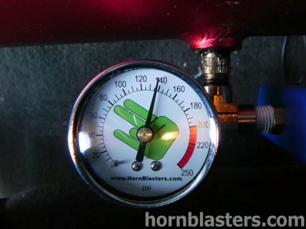 Close-up of the pressure gauge on the red air tank inside Thomas's 2005 Chevy Silverado 1500, install photo 8
