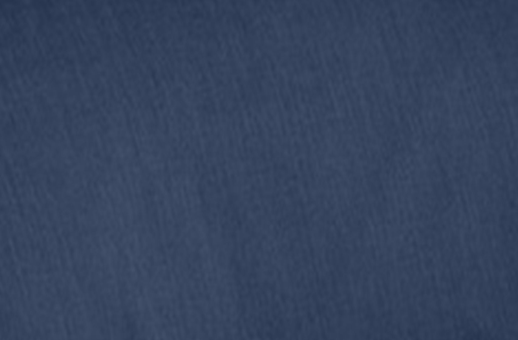 Dark blue textured fabric background.