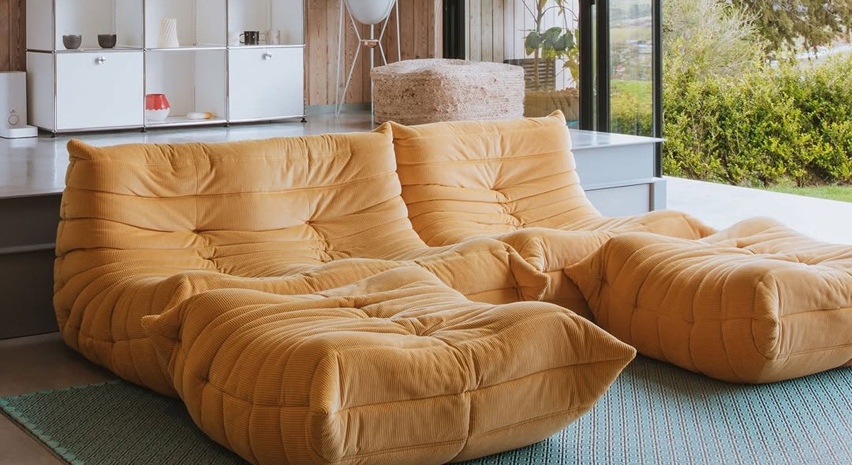 Two large, comfortable Togo seating solutions in a modern interior.
