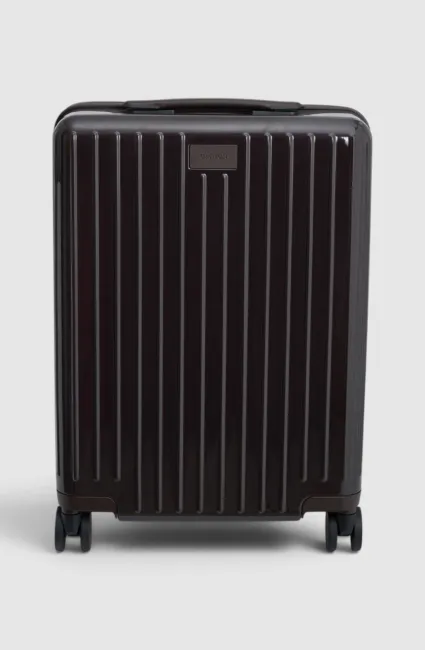 Black striped suitcase on wheels, viewed from the front.