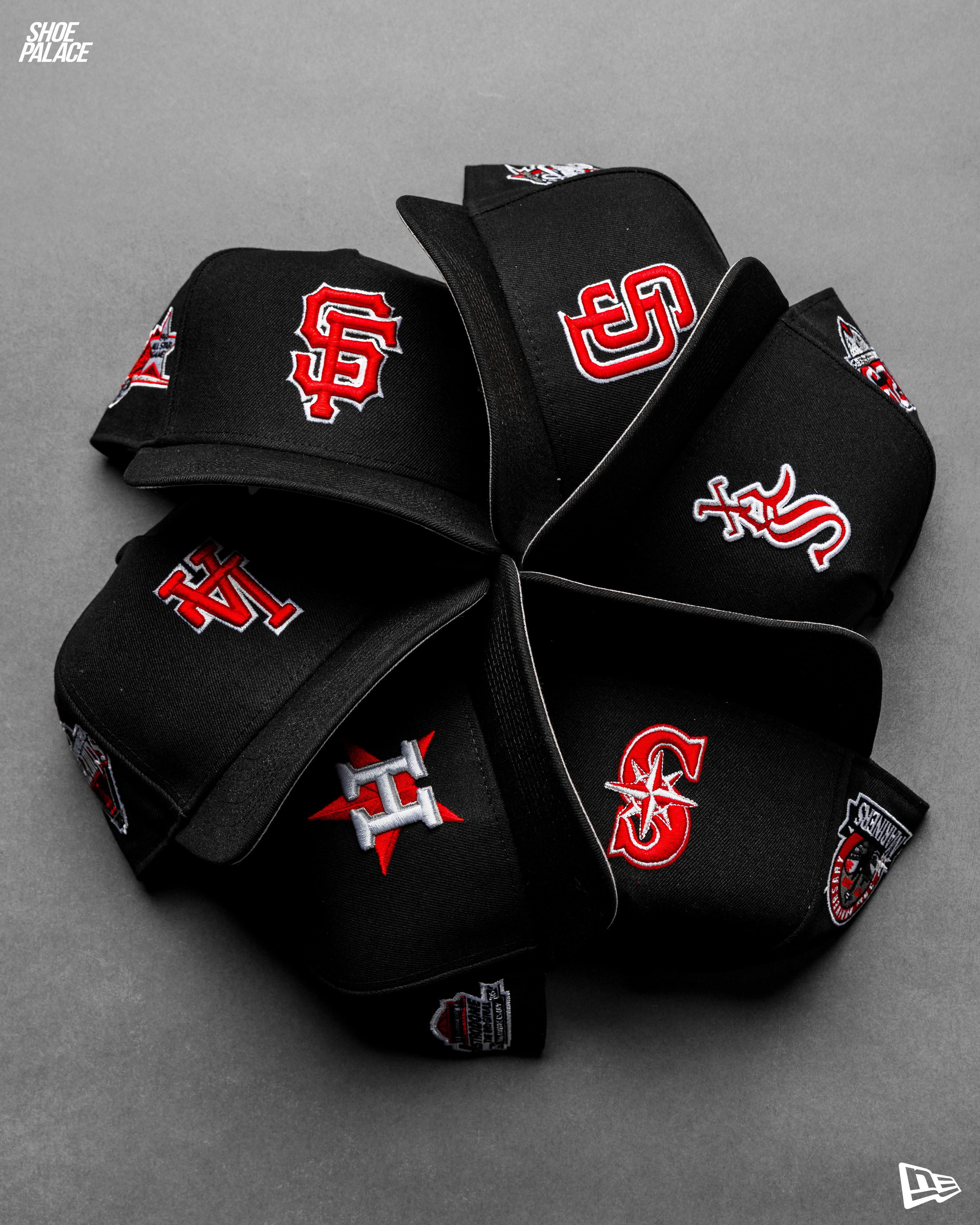 A circular arrangement of black baseball caps with various team logos.