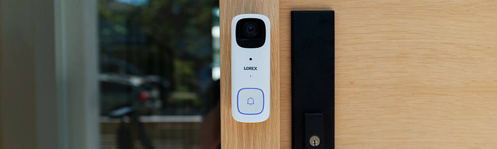 Battery operated smart video doorbell beside door handle