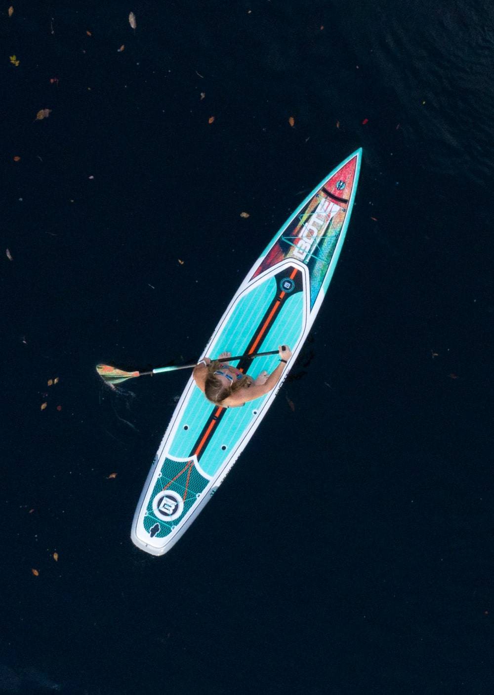 Overhead view of a woman paddling the Traveller Native Meadow