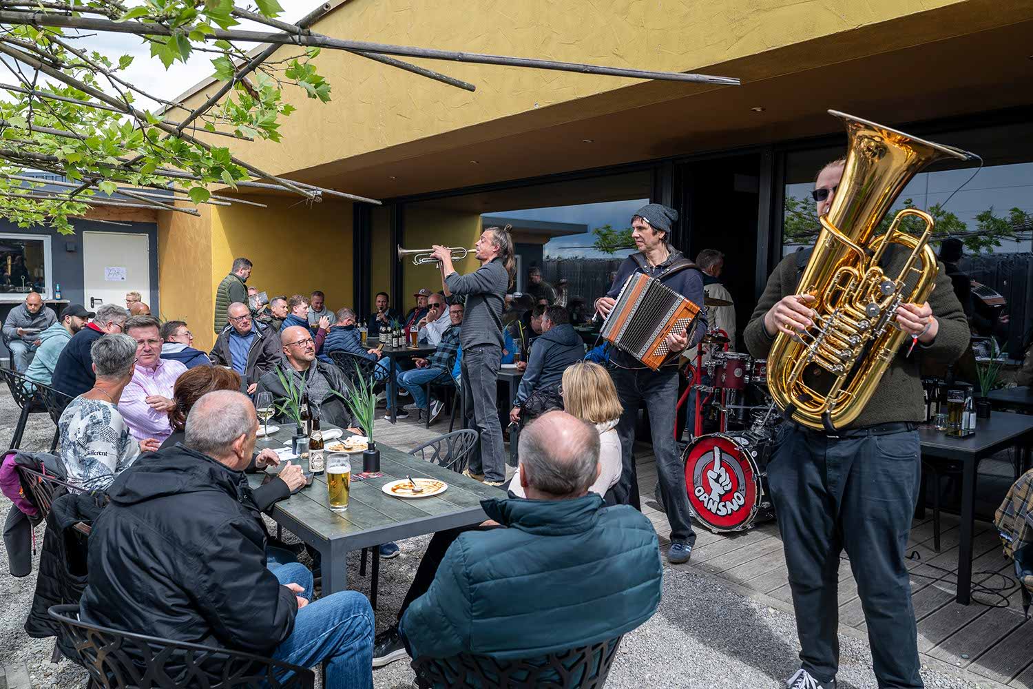 People enjoying live music at an outdoor café.