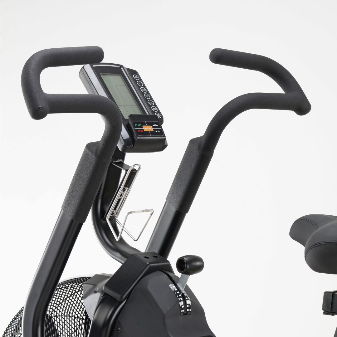 Close-up of exercise bike handlebars and console.
