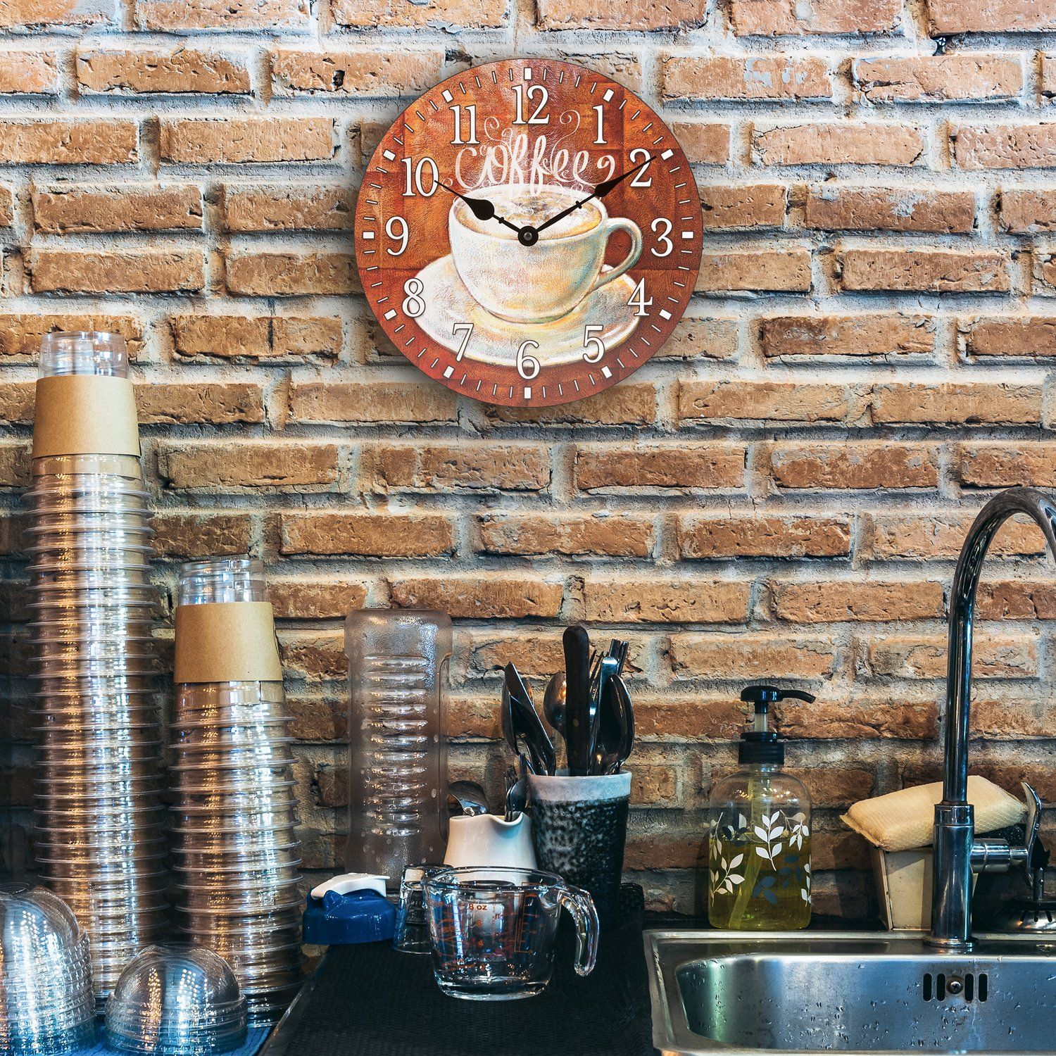 12-inch Coffee Clock with a coffee cup design on a brick wall above kitchen counter.