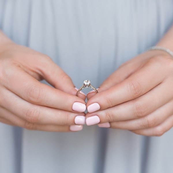 diamond ring held in hands