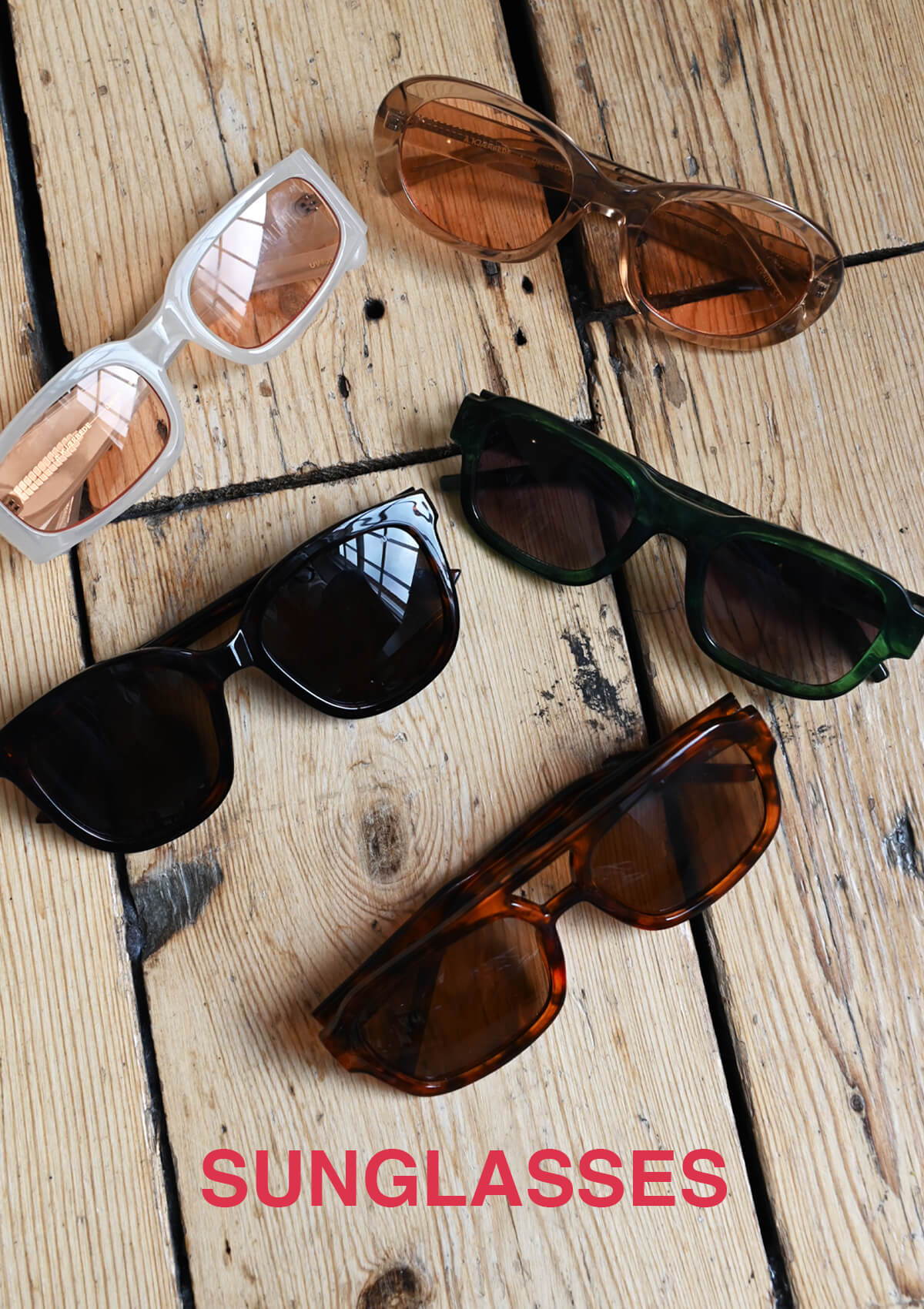 A still life styled image of multiple pairs of A.Kjaerbede sunglasses.
