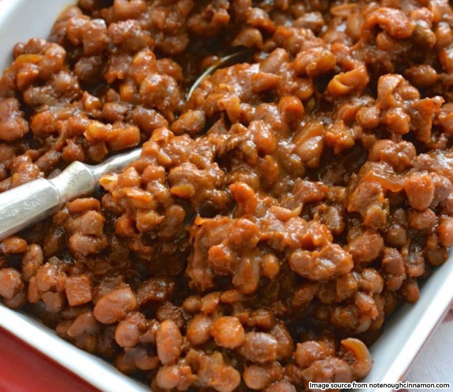 close up of baked beans with spoon