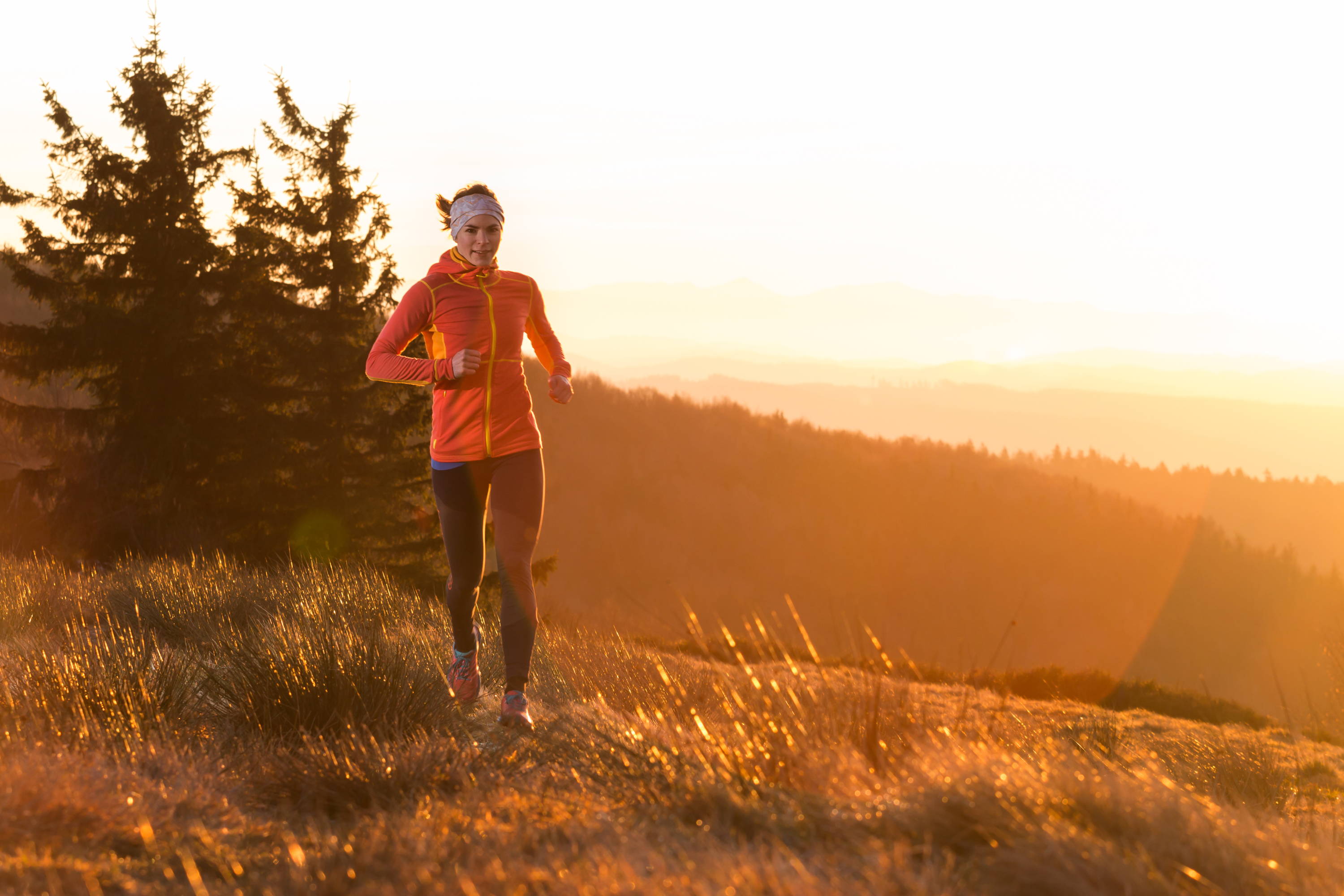 Woman running in cold weather, woman running in mountains