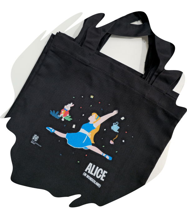 Black tote bag with an illustrated alice in wonderland character in motion printed in clean, vibrant colours.