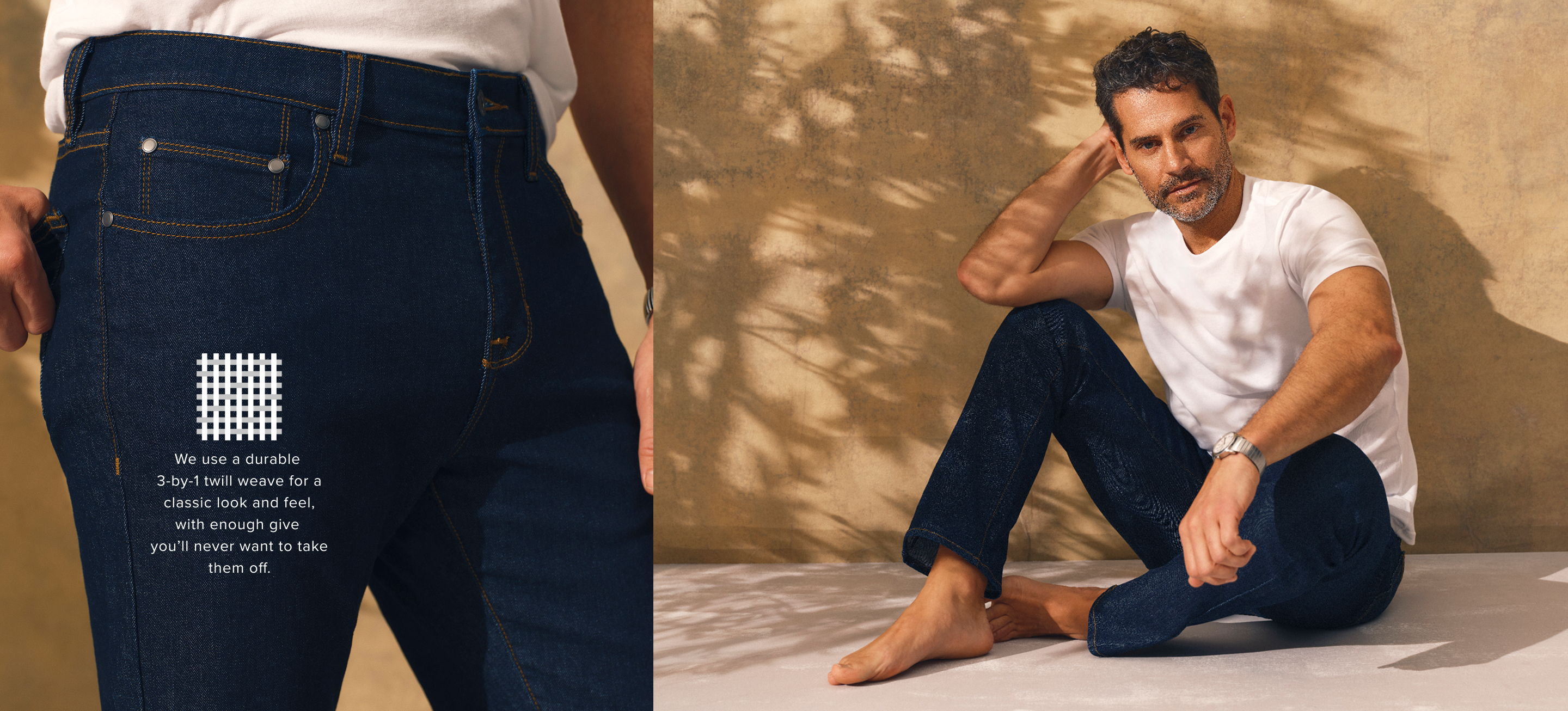 Man in white shirt sitting, wearing dark jeans, with text on back pocket.