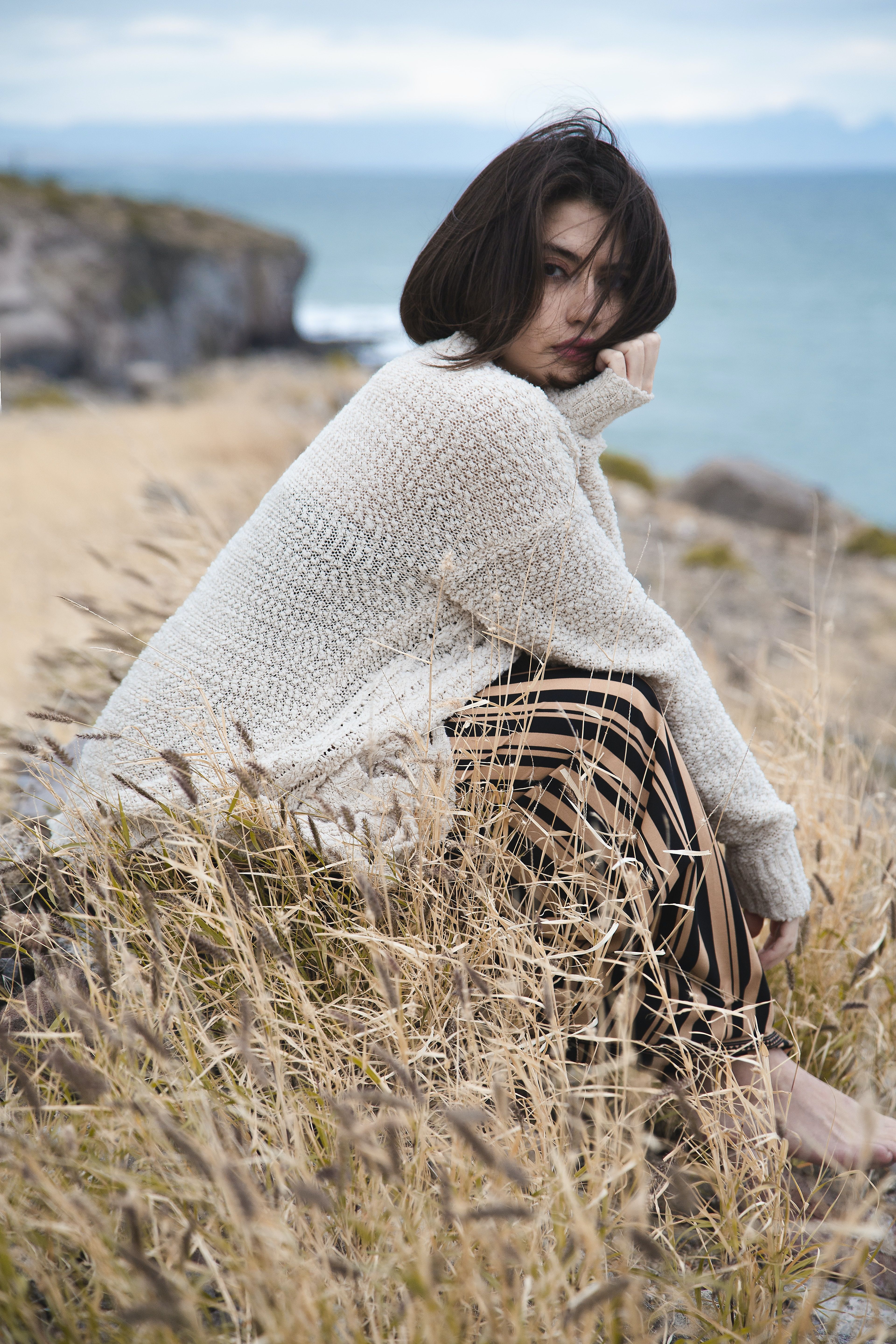 Image of woman sitting in a field