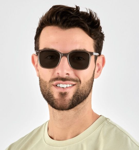 man wearing Marvel grey, squared acetate sunglasses, on a white background