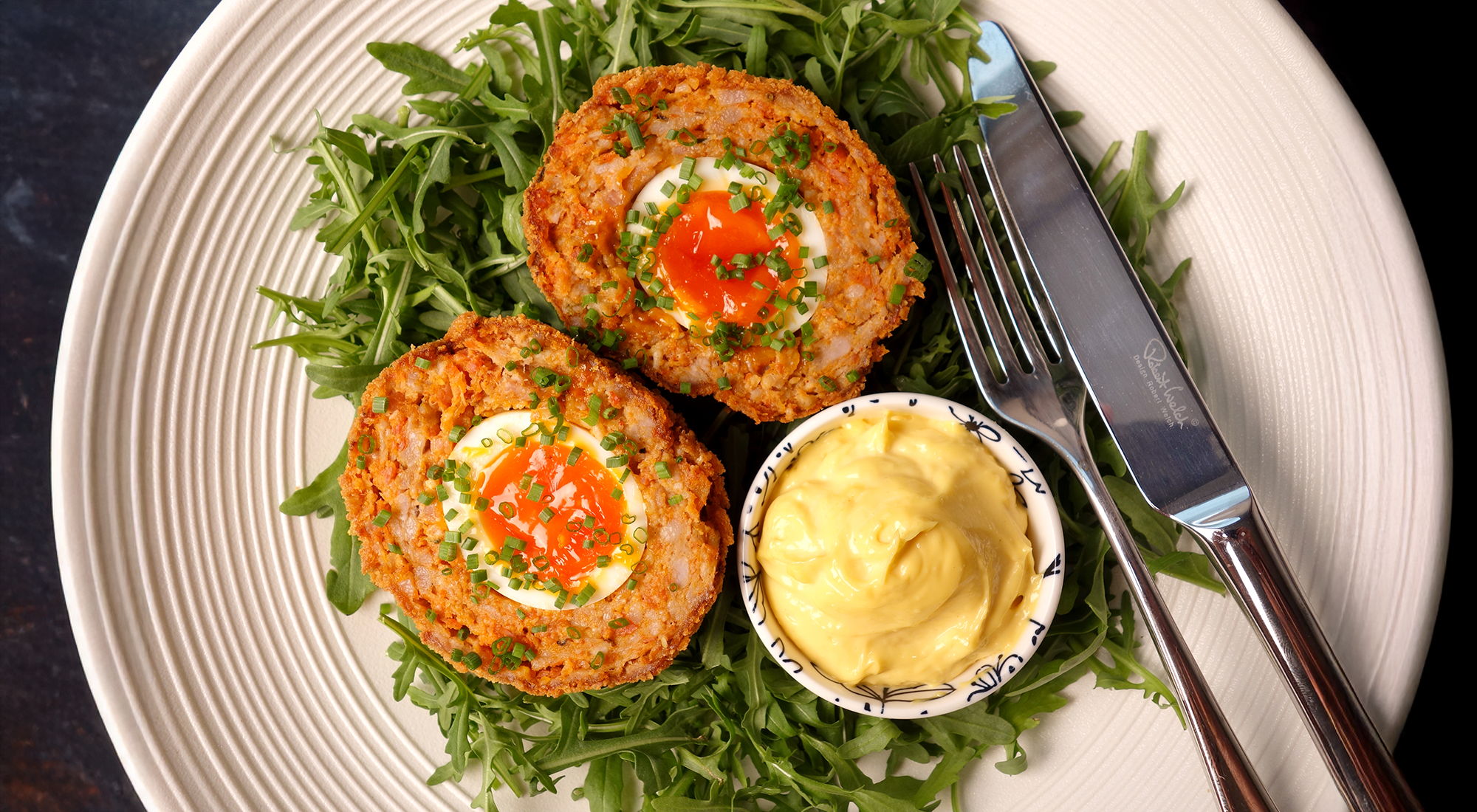 Chorizo scotch eggs with garlic aioli
