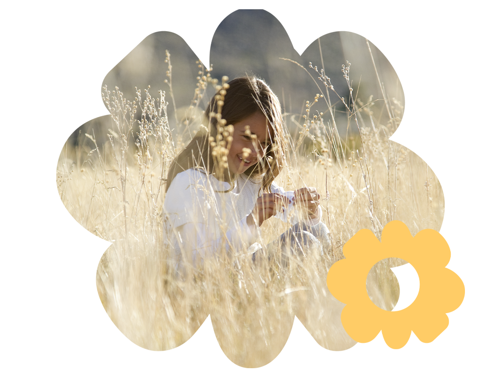 A young girl in a field of grass