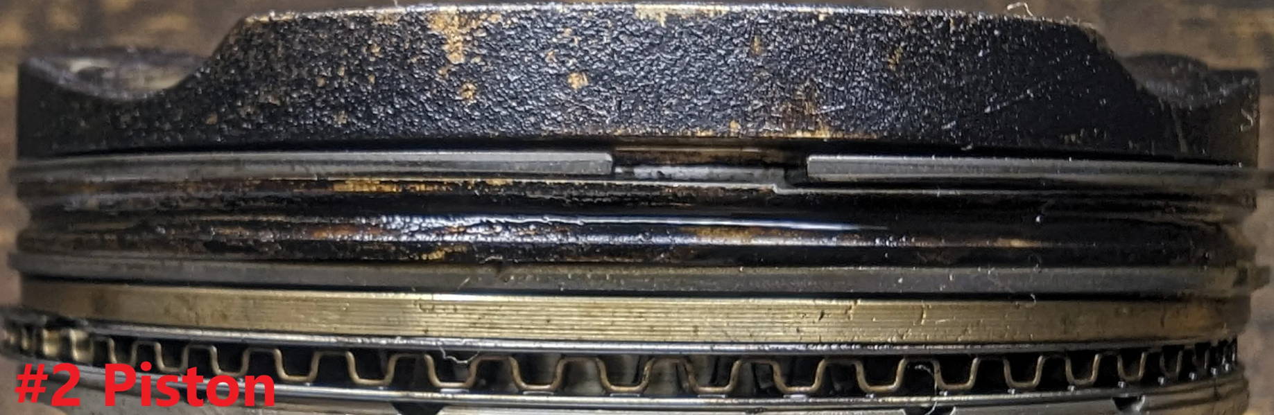 Close-up of layered mechanical components with visible wear and texture.
